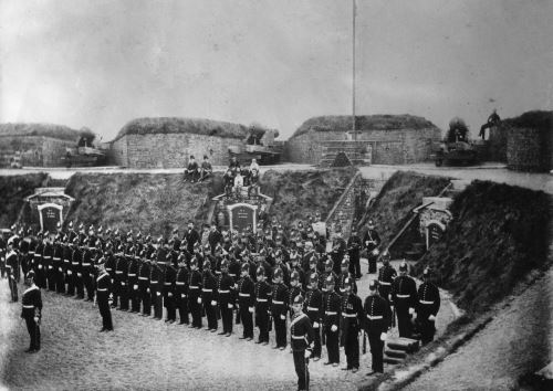 A group of volunteers at the Fort in formation